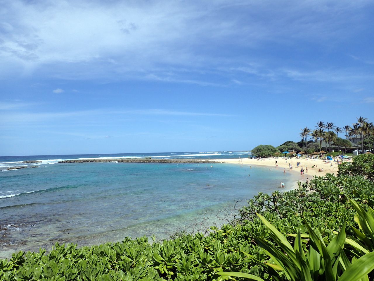 People play at Kuilima Cove Beach at Turtle Bay, Oahu Island North Shore, Hawaii, Oahu beaches for families