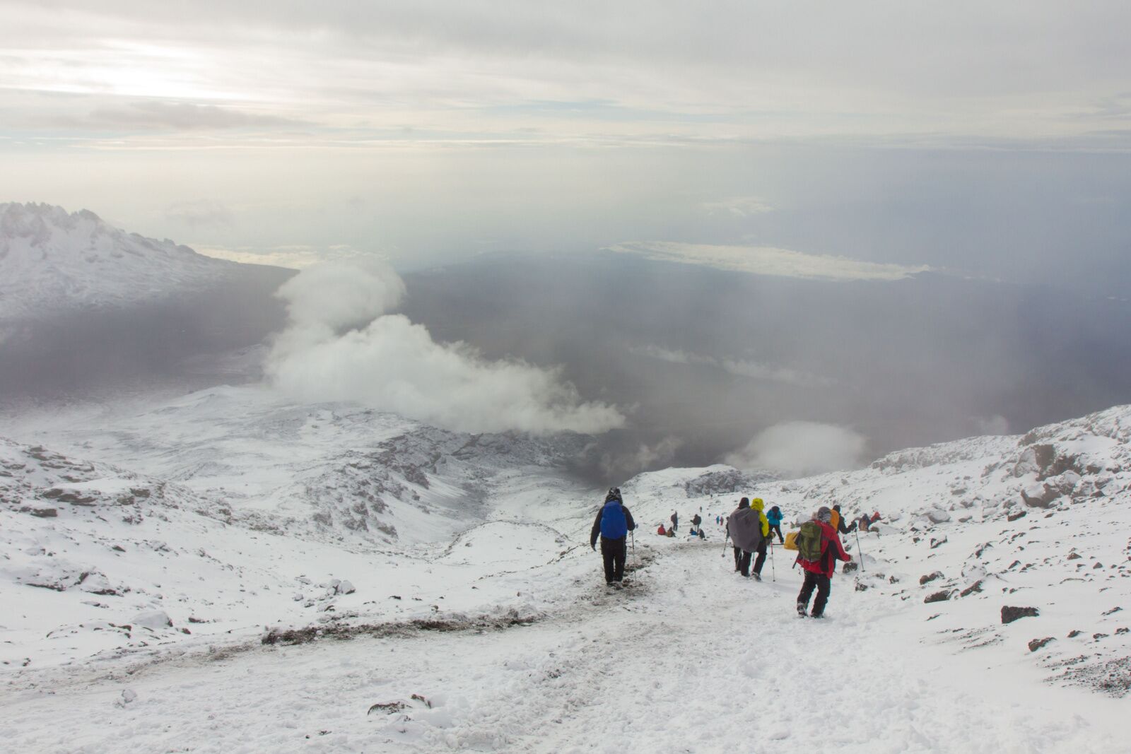 how hard is it to climb mount kilimanjaro- snow hikers people on trail