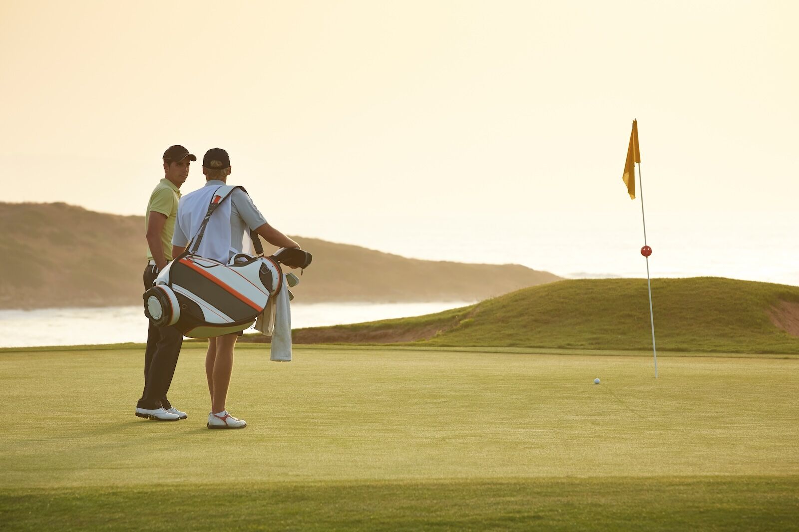 two men on putting green